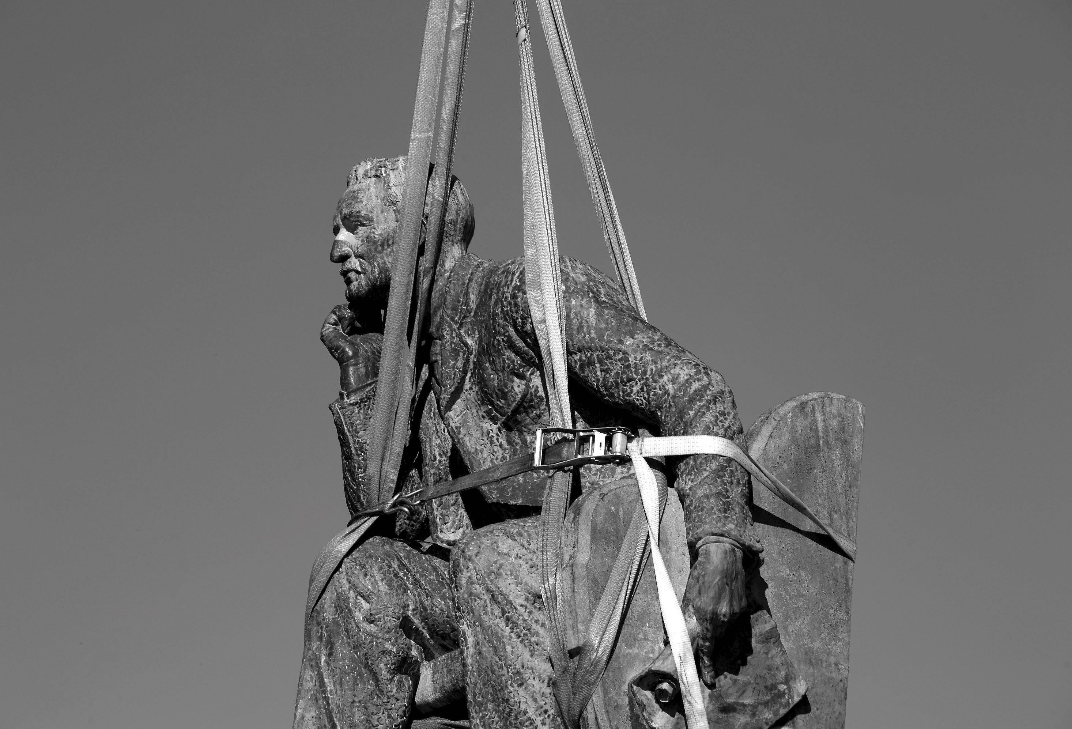 The statue of Cecil Rhodes on the campus of the University of Cape Town is prepared for removal. 2015.