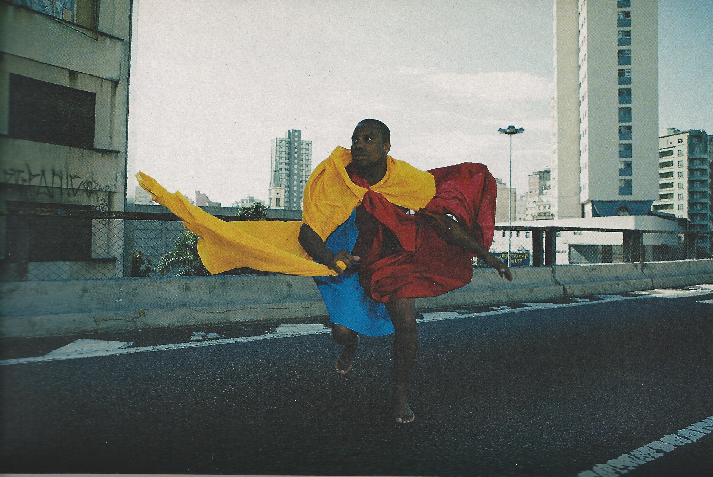 A performer from the Mangueira samba school wearing one of Hélio Oiticica's parangolés. 1964.