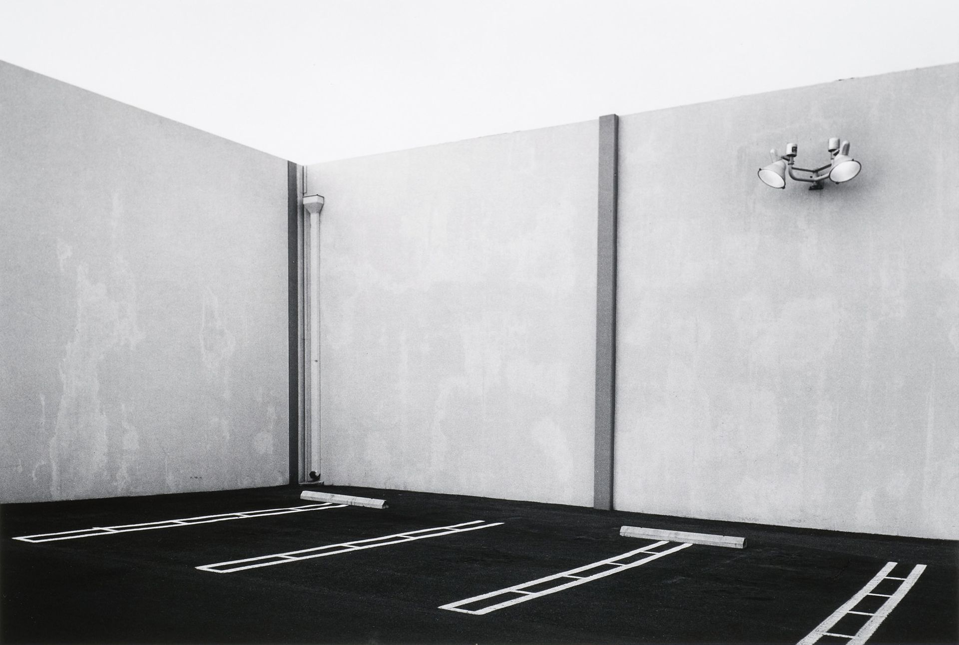 Lewis Baltz. South Corner, Parking Area, 23831 El Toro Road, El Toro. 1974.From the series The New Industrial Parks Near Irvine, California. 